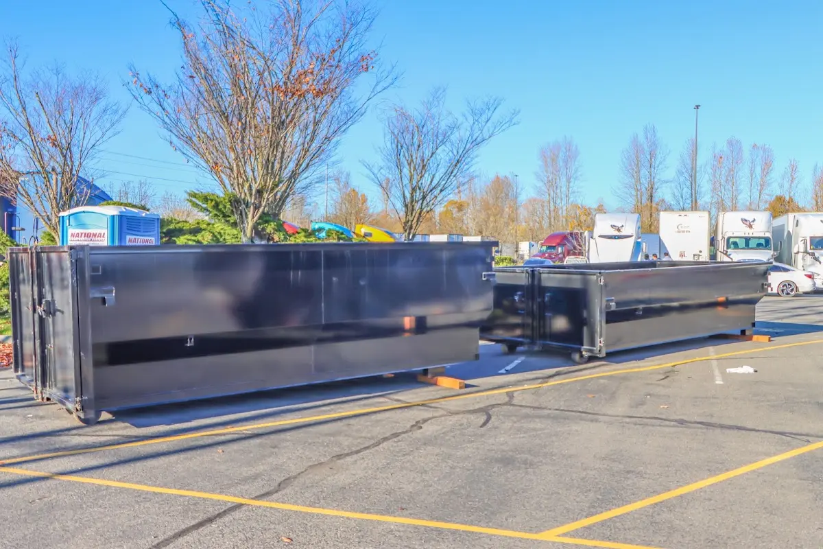 Professional dumpster rental service with roll-off container on residential driveway in Westbrook