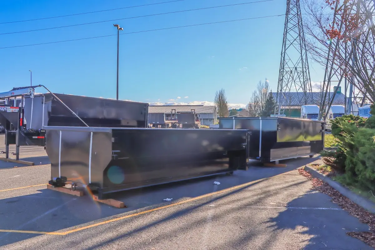 Roll-off dumpster ready for waste disposal at job site for Yard Waste Dumpster Rental in Westbrook